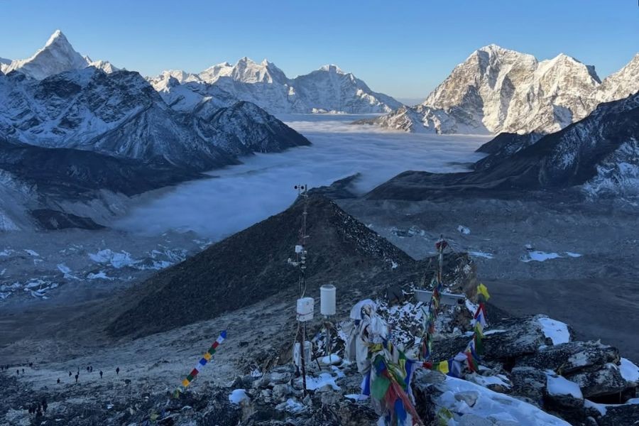  Prayer flags at Kala Patthar summit with panoramic Everest mountain views